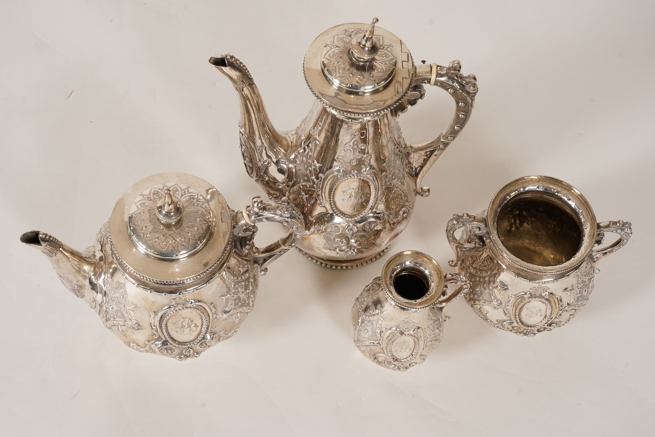 A Victorian ornate silver four piece tea and coffee service, by Thomas Smily